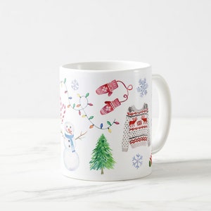 May include: White ceramic mug with a winter holiday theme. The mug features a snowman, a Christmas tree, mittens, a candy cane, a string of lights, snowflakes, and a red and white patterned sweater.