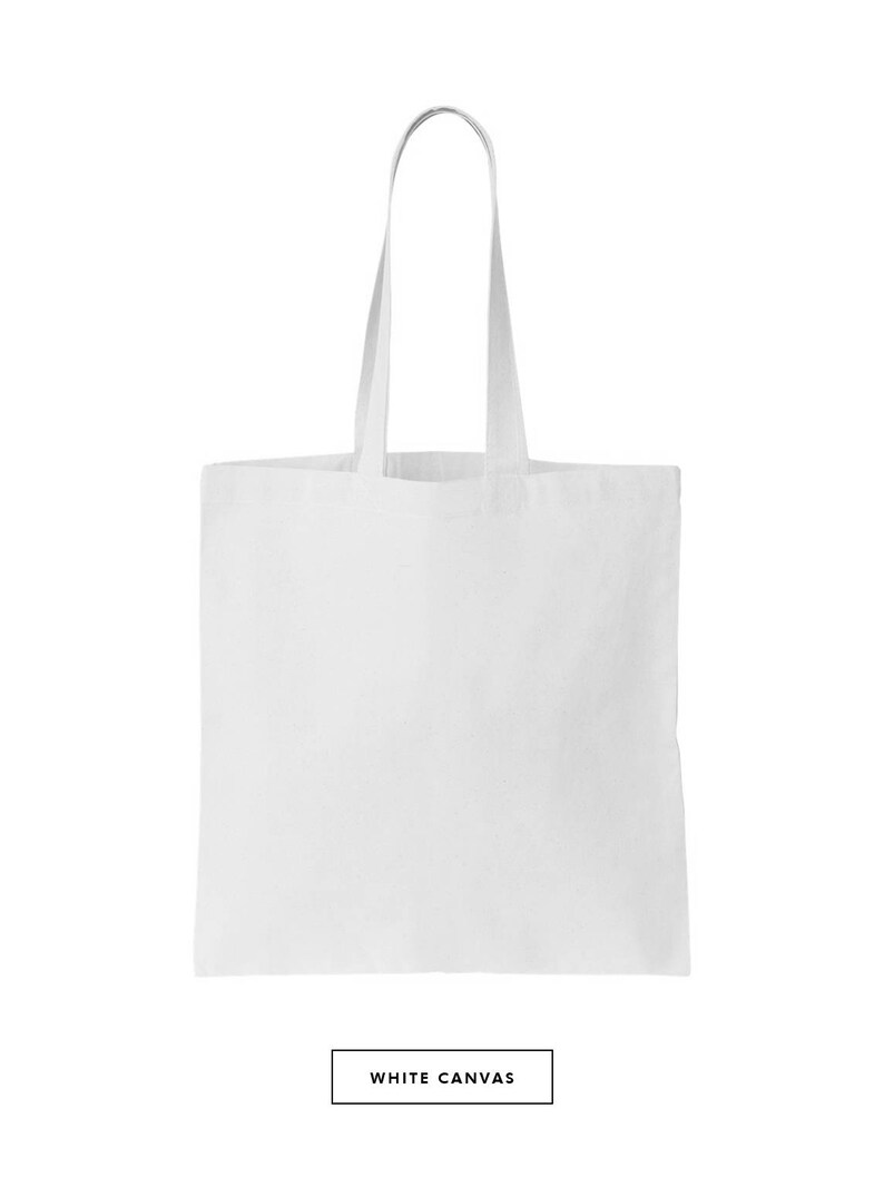 May include: A white canvas tote bag with two long handles. The bag is empty and ready to be filled with items.