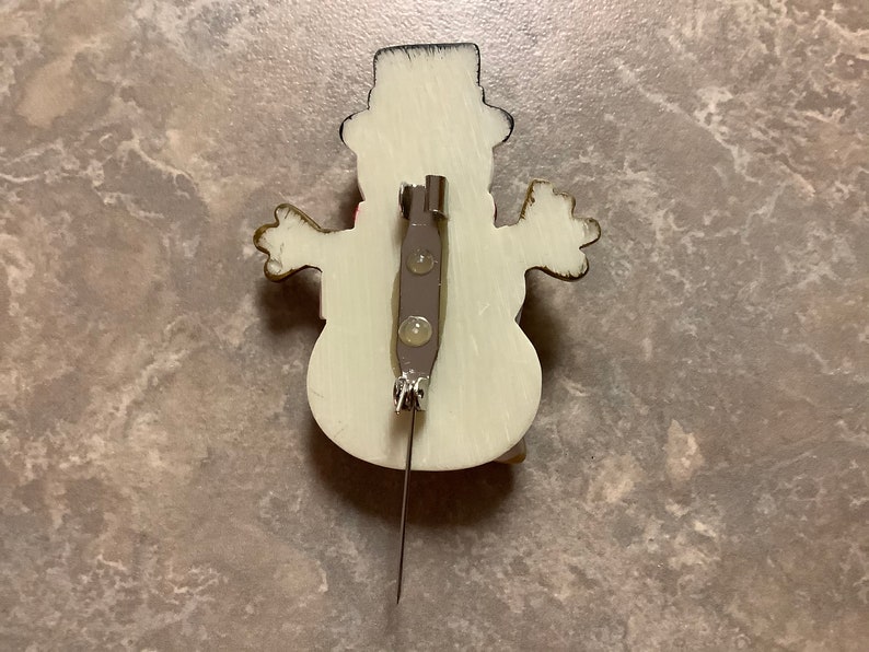 A Snowman Brooch with Pin.