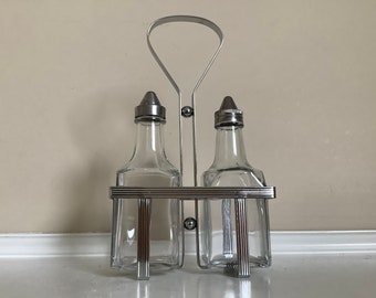 Glass Vinegar and Oil Cruet Set with a Metal Holding Caddy.