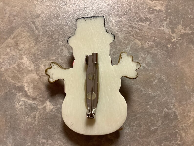 A Snowman Brooch with Pin.