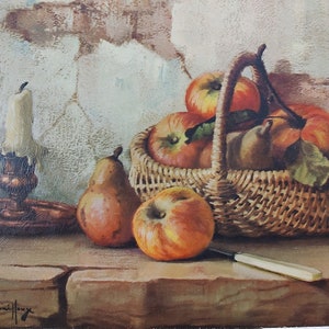 May include: A still life painting of a wicker basket filled with red apples and pears, with a candle holder and a knife on a wooden table. The painting is signed "Frank Chaillou".