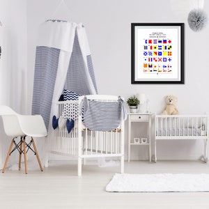 May include: A white crib with a blue and white striped canopy, a white rug, and a framed nautical flag chart with the text "International Maritime Signal Flags".