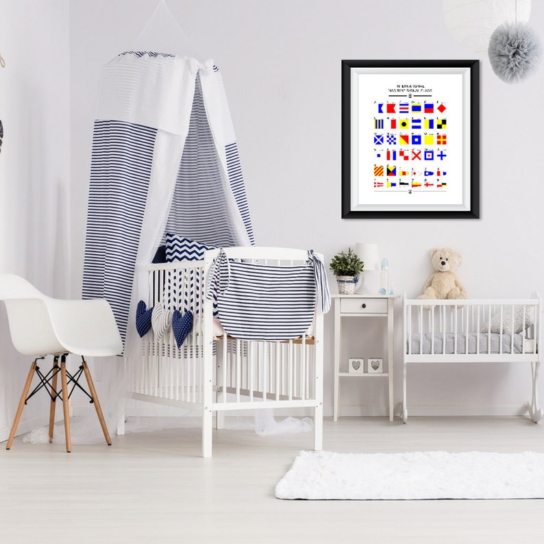 May include: A white crib with a blue and white striped canopy, a white rug, and a framed nautical flag chart with the text "International Maritime Signal Flags".