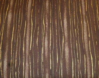 Patchwork fabric grey-brown with golden stripes
