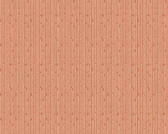 Tela patchwork naranja con lunares blancos