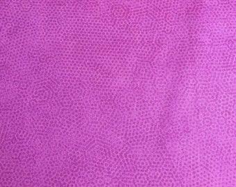 May include: A close-up of a purple fabric with a subtle, textured pattern of small dots.