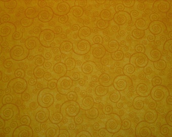 May include: A yellow fabric with a repeating pattern of brown swirls.