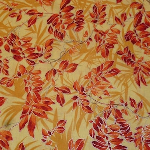 Patchwork fabric orange leaves on yellow with silver