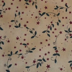 Patchworkstoff creme Blätter und roten Sternen