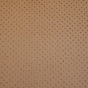 May include: A close-up of a light brown fabric with a subtle pattern of small, gold dots.