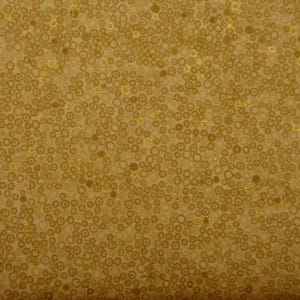 Tessuto patchwork beige oro marrone cerchi