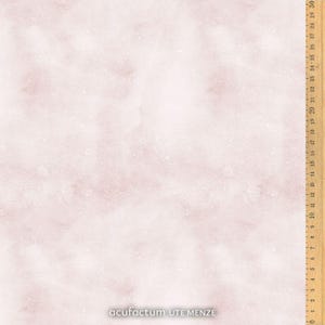 May include: A pale pink fabric with a watercolour effect, showing gentle tonal variations and scattered white speckles. A wooden ruler with inch markings is visible on the right edge. The text "acufactum UTE MENZE" is at the bottom.
