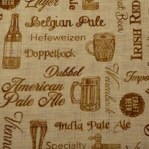 Patchworktyg med ölbokstäver i beige