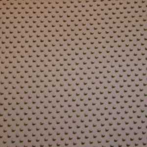 Patchworktyg, vitt och grönt mönstrat