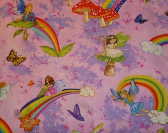 Patchwork fabric fairies in a rainbow