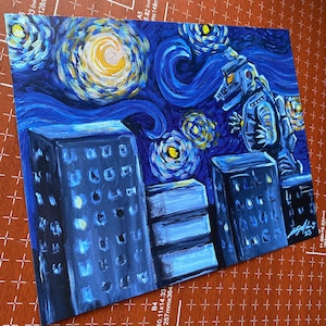 May include: A painting of a cityscape at night with a starry sky in the style of Vincent van Gogh. The painting features a robot in the foreground, standing on a building. The buildings are painted in a blue and white color scheme, and the sky is a swirling blue and yellow.
