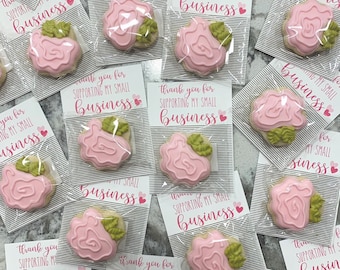 May include: A collection of small pink and green sugar cookies with the text "Thank you for supporting my small business" on a white background.