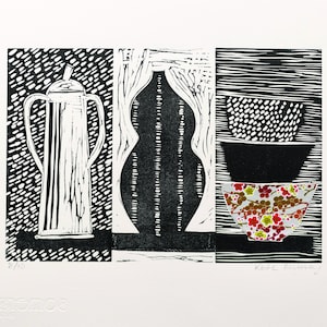 May include: A black and white linocut print featuring three distinct panels. The left panel shows a tall, handled pitcher. The center panel depicts a vase-like shape. The right panel displays three bowls, one with a floral pattern.