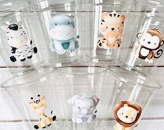 May include: Set of 7 clear plastic cups with animal themed stickers. The stickers feature a zebra, hippopotamus, tiger, monkey, giraffe, elephant, and lion.