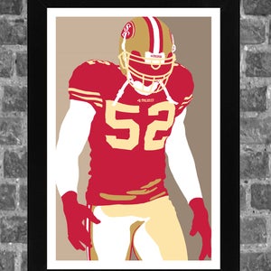 May include: A red and gold football jersey with the number 52 on the front. The jersey has the words "49ers" on the chest and the helmet. The player is wearing a gold helmet with a red logo.