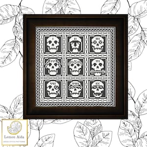 May include: Black and white cross stitch pattern featuring nine skull designs in a grid pattern. The pattern is framed in a dark brown frame.