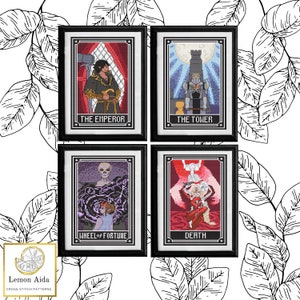 May include: Four tarot cards in black frames with white mats. The cards are The Emperor, The Tower, Wheel of Fortune, and Death. Each card has a colorful illustration and the name of the card printed below the image.
