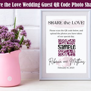 May include: A white frame with a sign that says "SHARE the LOVE!" with a QR code and the text "Sample" below it. The sign also includes the names "Rebecca and Matthias" and the date "February 14, 2023".