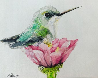May include: Watercolor painting of a hummingbird perched on a pink flower. The hummingbird is green and gray with a long beak. The flower has a yellow center and is surrounded by green leaves.