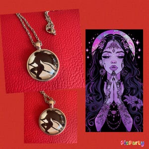 May include: A silver necklace with a round glass pendant featuring a black and white silhouette of a woman with long hair and flowing robes. The pendant is surrounded by a silver frame. The necklace is on a red background.