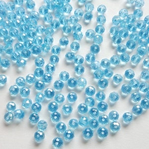 50 mini perle 3x2 mm o 4x3, turchese traslucido, vetro sfaccettato, forma abaco - 50 perle a ciambella in cristallo sfaccettato color acquamarina, 2 misure