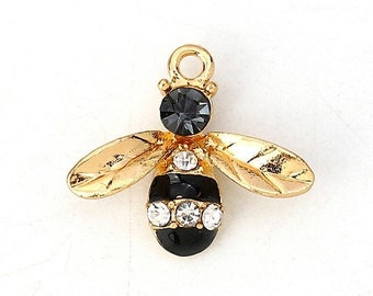 2 Breloques ABEILLE NOIRE 17*15mm, émail s/doré clair, strass gris foncé - 2 enameled black bee charms, light gold, dark grey rhinestones