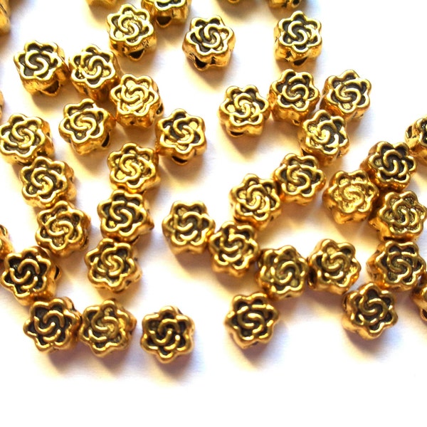 11 mini perles intercalaires "fleur stylisée" 4x3mm, vieil or, motif floral gravé - 11 tiny flat stylized flower spacer beads dark gold tone