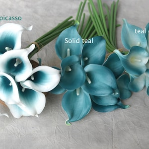 May include: Arrangement of artificial calla lilies in shades of teal and white. The flowers are grouped into bouquets with green stems. The image includes the text "teal picasso", "solid teal", and "teal edge".
