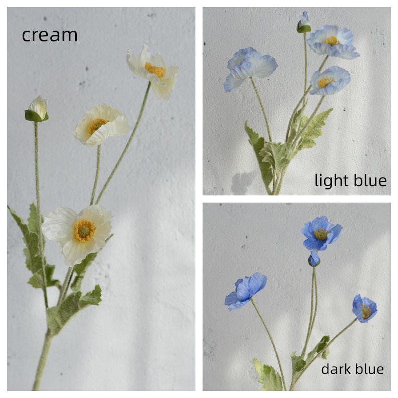 May include: Three artificial poppy flower stems in cream, light blue, and dark blue. The flowers are made of fabric and have a realistic appearance.