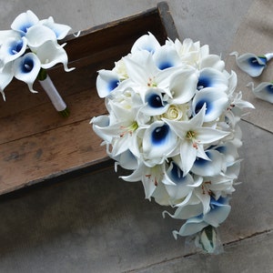 Royal Blue Wedding Bouquets, Real Touch Picasso Calla lilies, Tiger Lilies, Ivory Roses, Cascade Bridal Bouquets, Boutonnieres