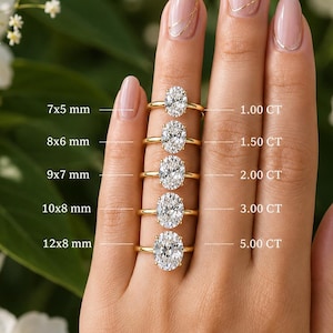 May include: Five gold rings with oval-cut clear stones in varying sizes. Labels indicate dimensions from 7x5 mm to 12x8 mm and weights from 1.00 CT to 5.00 CT. The rings are arranged vertically, showcasing different carat weights and stone proportions.