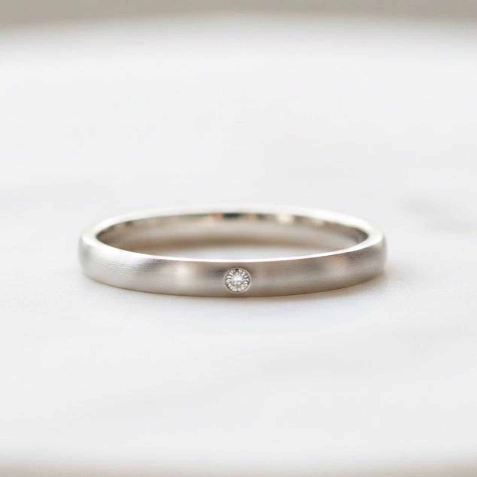 Minimalist white gold wedding band