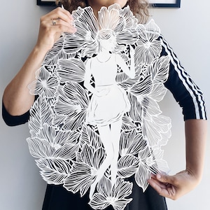 Paper cut girl , micro cuts , hand cut paper art , original paper cutting in white color , art silhouette of a girl on flower meadow