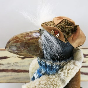 Charming textile sculpture of black raven who dreams of becoming a pilot. Sure to be the hit of any room, office or even over the fire place