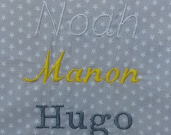 Embroidered name for bibs and placemats.