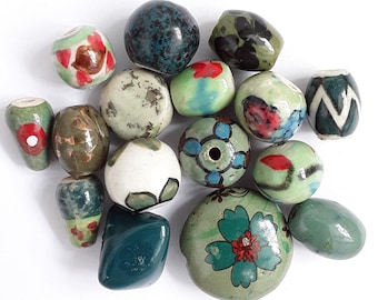 16 Handmade ceramic beads.  14mm-28mm