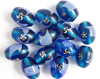 Loose beads. 13 handmade lampwork glass blue beads. Jewellery making and craft beads. Coloured glass beads. 20mm x 14mm.