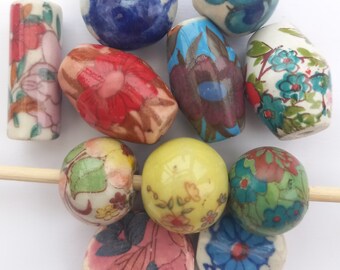 11 handmade ceramic beads. Vintage floral beads. Individual beads. Shaped beads