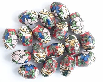 17 handmade beads. A matching set of handmade ceramic beads.