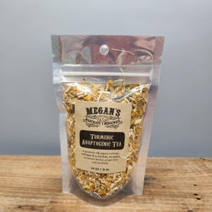 “Wooden board with  turmeric adaptogenic tea bag”