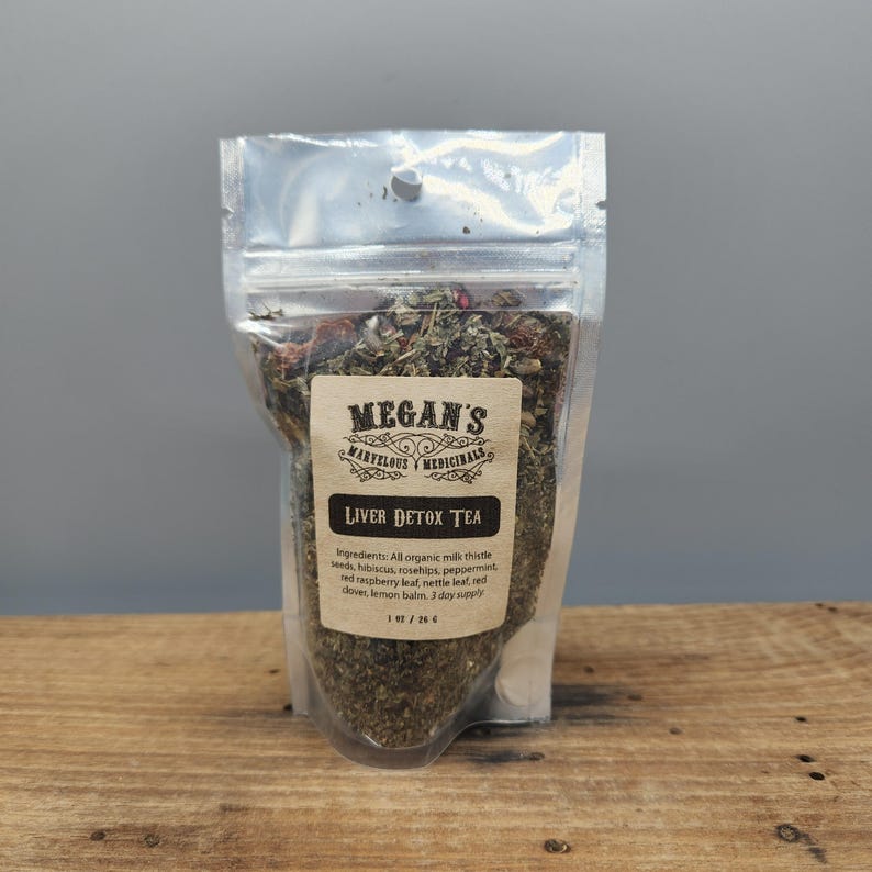 “Close up of milk thistle seeds and rosehips in loose leaf tea blend”
