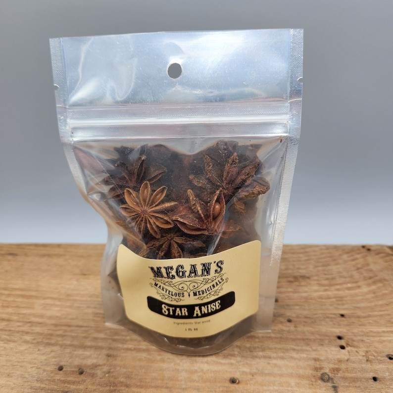 A clear plastic bag filled with brown star anise. The bag has a label that reads "Megan's Marvelous Medicinals Star Anise".