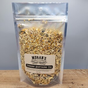 “Close up of turmeric, ginger, schisandra berries and adaptogenic herbs tea mix”