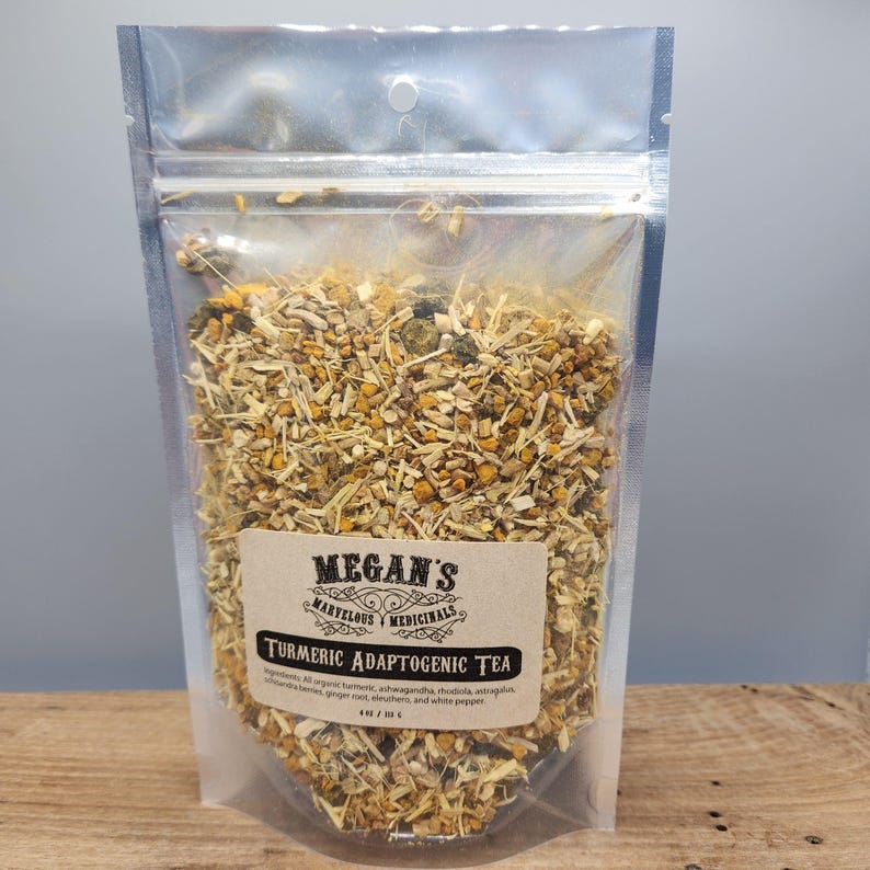 “Close up of turmeric, ginger, schisandra berries and adaptogenic herbs tea mix”